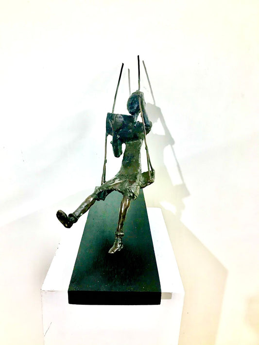 Serene Art Deco Bronze Sculpture: Girl Reading on a Swing by Usha Ramachandran