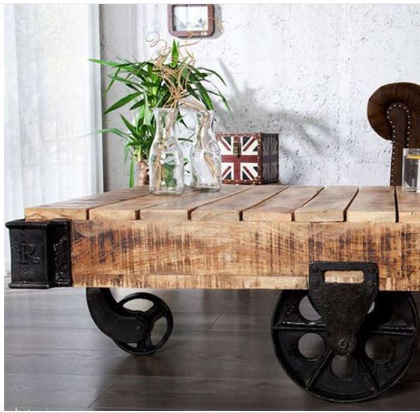 Cart Coffee table is a center table made in solid Sheesham wood with metal wheels and cast metal corners, It is easy to use and decorate things with wheels which make it easy to move in your living room. It is designed to create an industrial look in living room furniture at home.