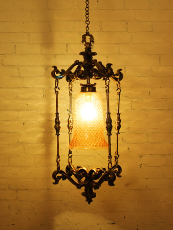 Elegant Spanish Antique Foyer Pendant Lamp with Brass Finish and Golden Glass