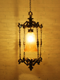 Elegant Spanish Antique Foyer Pendant Lamp with Brass Finish and Golden Glass