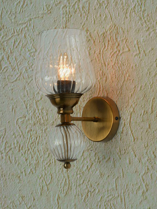 Antique Brass Finish Mild Steel Wall Sconce Accented with a Glass Ball and Fluted Glass Goblet Diffuser
