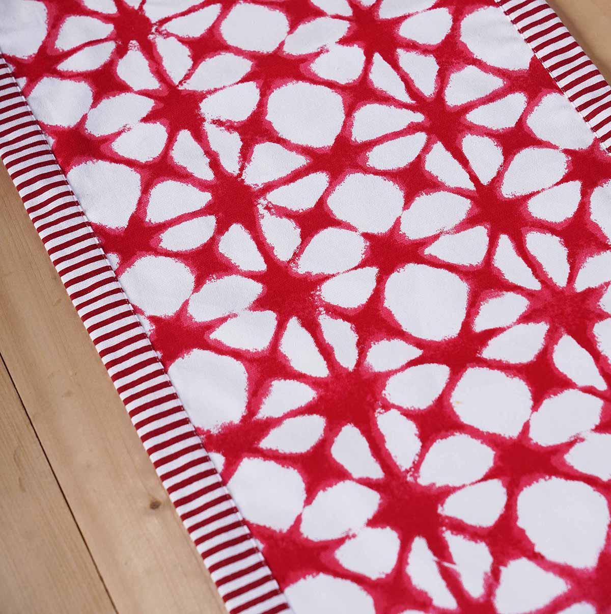 Red Tie Dye Prism Table Runner with Red Stripe Border