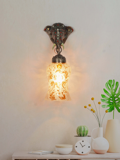 Exquisite Rustic Bronze Elephant Wall Sconce with Etched Amber Glass Shade